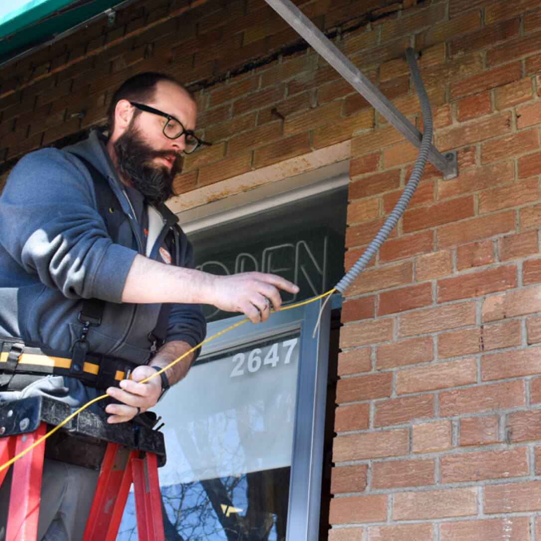 Electrician running cables